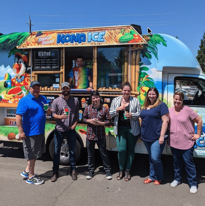 The KRS team enjoying shaved ice at a Kona Ice truck outside the Eugene facility