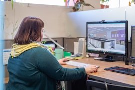 A KRS designer reviewing a 3D store model